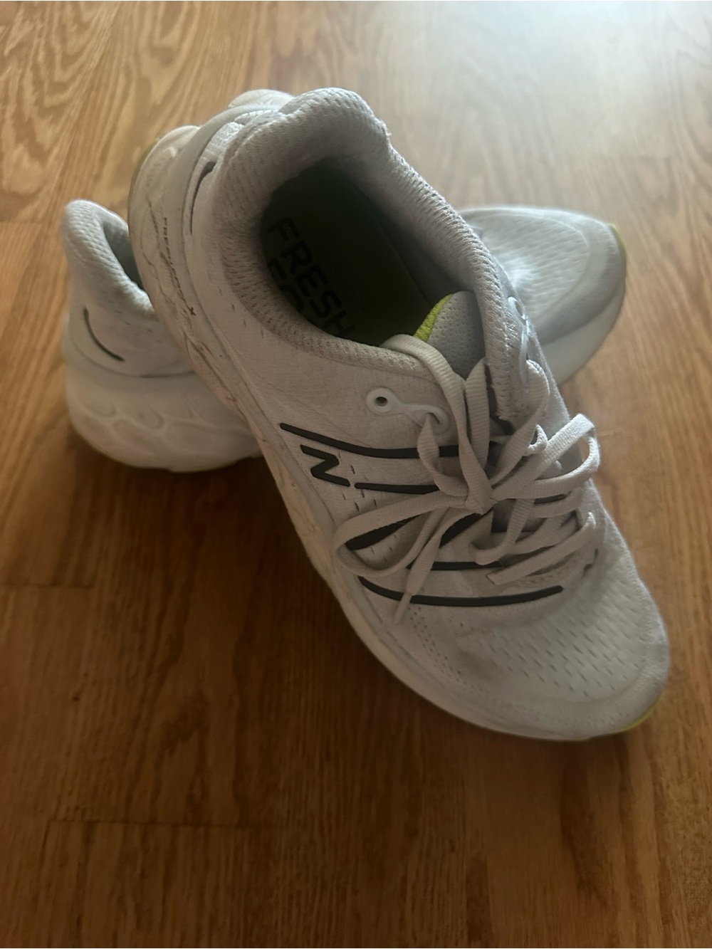 New Balance White Kids Sneakers with Black Stripe Accents